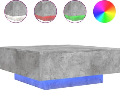 A concrete coffee table with a blue base, shown with examples of LED light colors.
