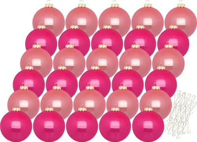 A collection of pink and magenta Christmas ornaments arranged in rows.