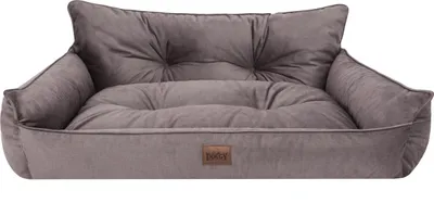 A brown pet bed with a tufted cushion and raised sides, presented against a white background.