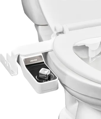 A bidet toilet seat attachment is installed on a toilet bowl.