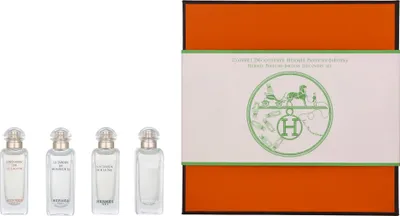 A set of four small perfume bottles and a gift box are displayed on a white background.