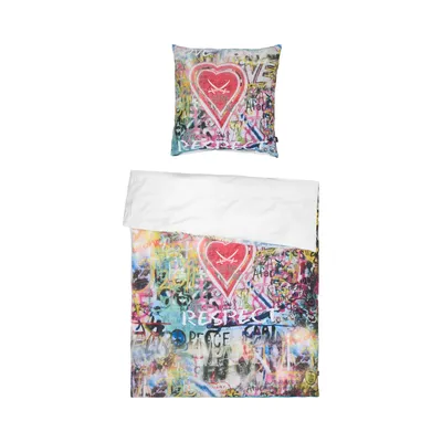 A pillow and a duvet cover with a graffiti-style design featuring a heart and text.