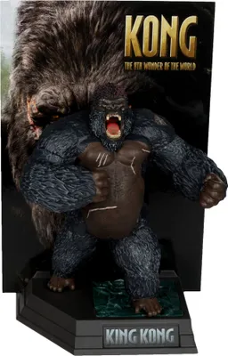 A King Kong figure on a display stand with a backdrop.