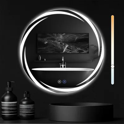 A modern bathroom setting with a round LED mirror, a black bathtub, and two black soap dispensers.