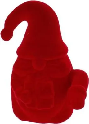 A red velvet gnome figurine holding a gift.