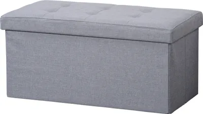 A gray ottoman with a tufted lid.