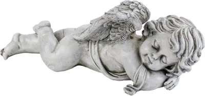 A stone-like figurine of a sleeping cherub with wings, lying on its side.