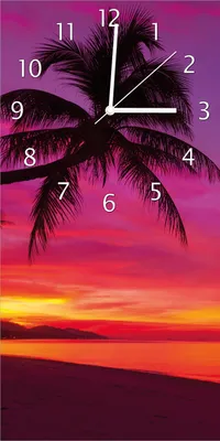 Produktbild von Wallario Design Wanduhr Abendrot unter Palmen - pinker Himmel am Strand aus Echtglas, Größe 30 x 60 cm