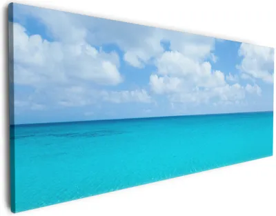 Produktbild von Wallario Premium Leinwandbild Sandstrand und blaues Meer in Größe 60 x 150 cm
