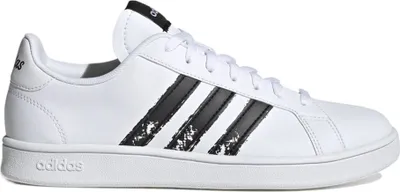 A side view of a white Adidas Grand Court Beyond sneaker with black stripes.