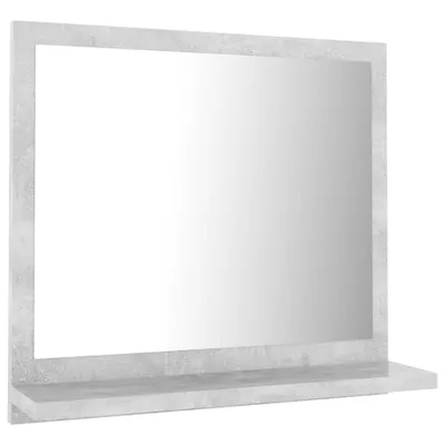 A mirror with a shelf attached, presented against a white background.