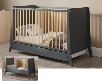 A crib with bedding and pillows inside, shown in a room setting. A smaller inset image shows the crib from a different angle.