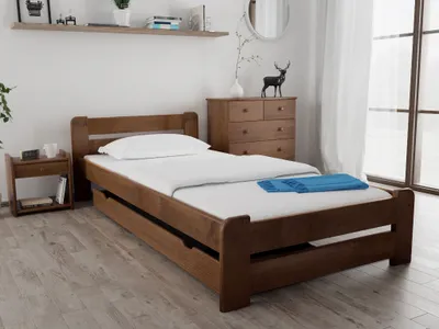A wooden bed with a pull-out trundle bed in a bedroom setting.