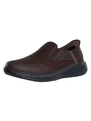 A single brown slip-on sneaker is shown against a white background.