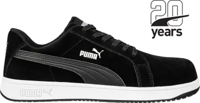 A black Puma safety shoe with a white sole, shown from the side against a white background. A graphic indicating '20 years' with a Puma logo is in the upper right corner.