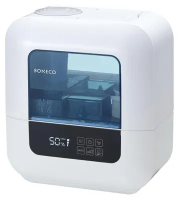 A white humidifier with a blue water tank and a digital display.