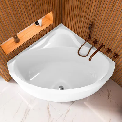 A white corner bathtub with wooden paneling in the background and a marble-tiled floor.