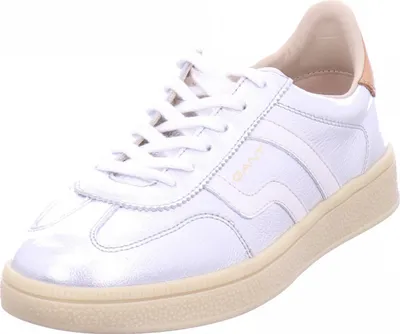 A white Gant sneaker with tan accents is shown against a white background.