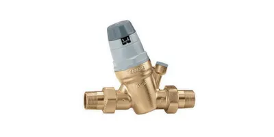 A brass pressure reducing valve with a gray adjustment knob is shown against a white background.