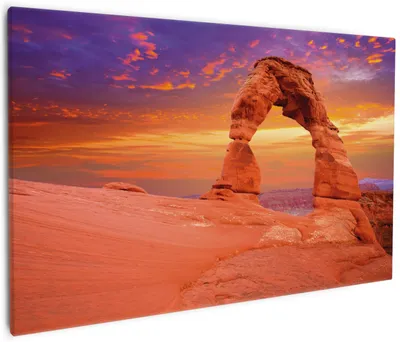 Produktbild von Wallario Premium Leinwandbild Steinbogen vor einem farbenfrohen Himmel in lila-rot in Größe 60 x 90 cm