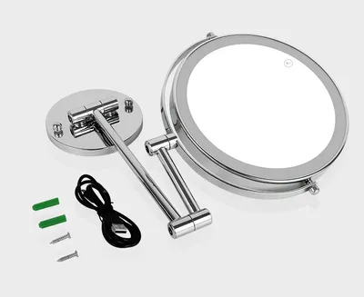 A makeup mirror and its accessories are laid out on a white background.