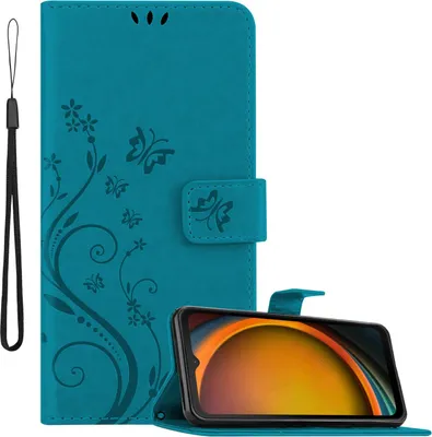 A teal flip-style phone case with a floral and butterfly design is shown open, with a smartphone inserted. A wrist strap is attached to the left side of the case.