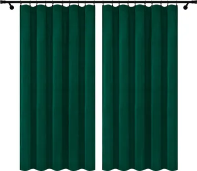 Two dark green velvet curtains hanging from a curtain rod against a white background.