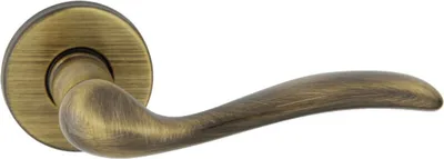 A single bronze door handle on a white background.