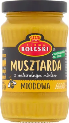 A jar of mustard with a label.