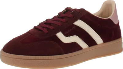 A single burgundy sneaker is shown against a white background.