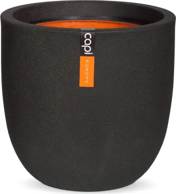 A black planter pot with an orange interior and a brand label.