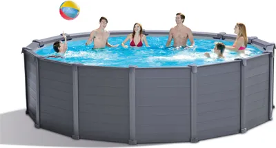 People are enjoying themselves in an above-ground swimming pool.