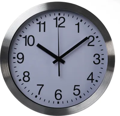 A close-up of a white and silver analog wall clock against a white background.