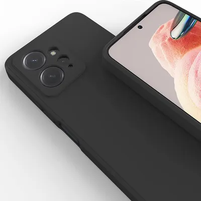 A black silicone phone case is shown from a diagonal angle, with the camera module and a portion of the screen visible.