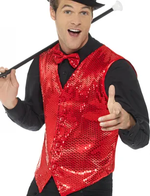 A man wearing a red sequined vest and a black shirt, holding a cane.