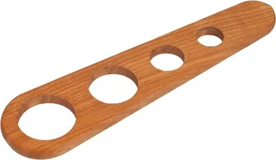 A wooden spaghetti measure with three holes of different sizes.