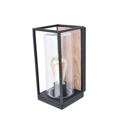 A wall lamp with a black metal frame, a clear glass cylinder, and a wooden back panel.