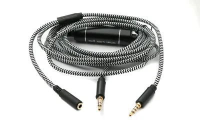 A coiled audio cable with multiple connectors and a control module, laid out on a white background.