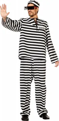 A man wearing a prisoner costume, including a striped shirt, pants, and hat, and glasses.