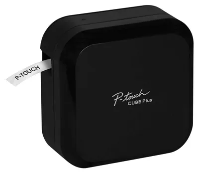 A black Brother P-Touch Cube Plus label maker is shown from a slightly elevated side angle against a white background. A white label with black text "P-TOUCH" is exiting the device.