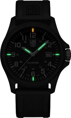A black Luminox watch with luminous green hour markers and hands, displayed against a black background.