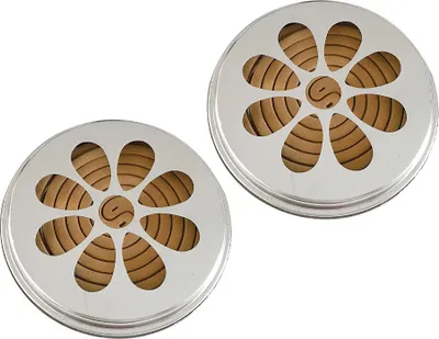 Two citronella incense coils with flower-shaped metal holders are shown against a white background.