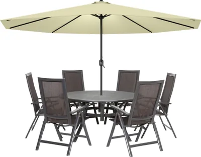 An outdoor dining set with a large umbrella and chairs around a table.