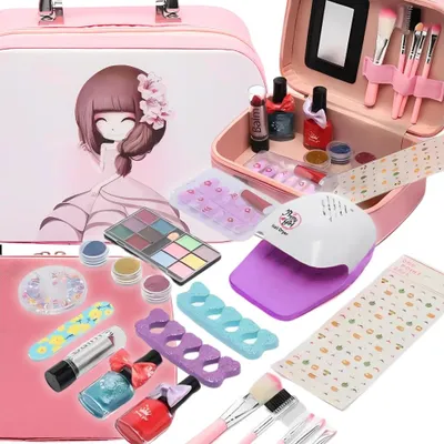 A collection of children's makeup and nail art items, including a makeup case, nail polish, brushes, and a nail dryer.