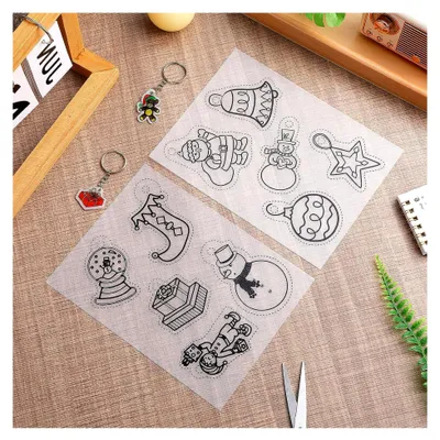 Produktbild von 12 Stück Handgefertigte Schrumpffolien mit Weihnachtsdesigns für Bastelarbeiten, Schlüsselanhänger, Schmuck und Spielzeug