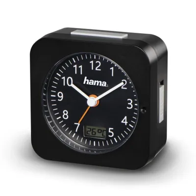 A black alarm clock with a digital display showing the temperature.
