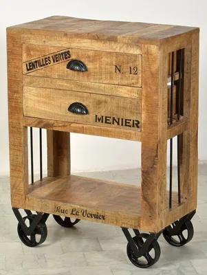 A vintage-style wooden side table with drawers and metal wheels.