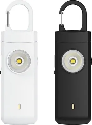 Produktbild von Persönliche Alarmknöpfe - 2 Stück - 130 dB Sirene mit LED - Taschenlampe - Selbstverteidigung - Sicherheit - Touchbedienung - oplaadbar via USB - Schwarz/Weiß