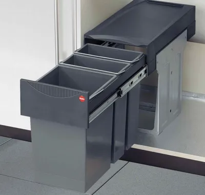 A pull-out kitchen waste bin system with three compartments.
