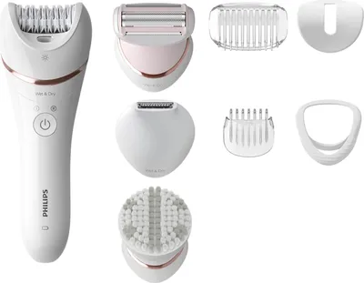 A collection of personal grooming devices and attachments laid out on a white background.